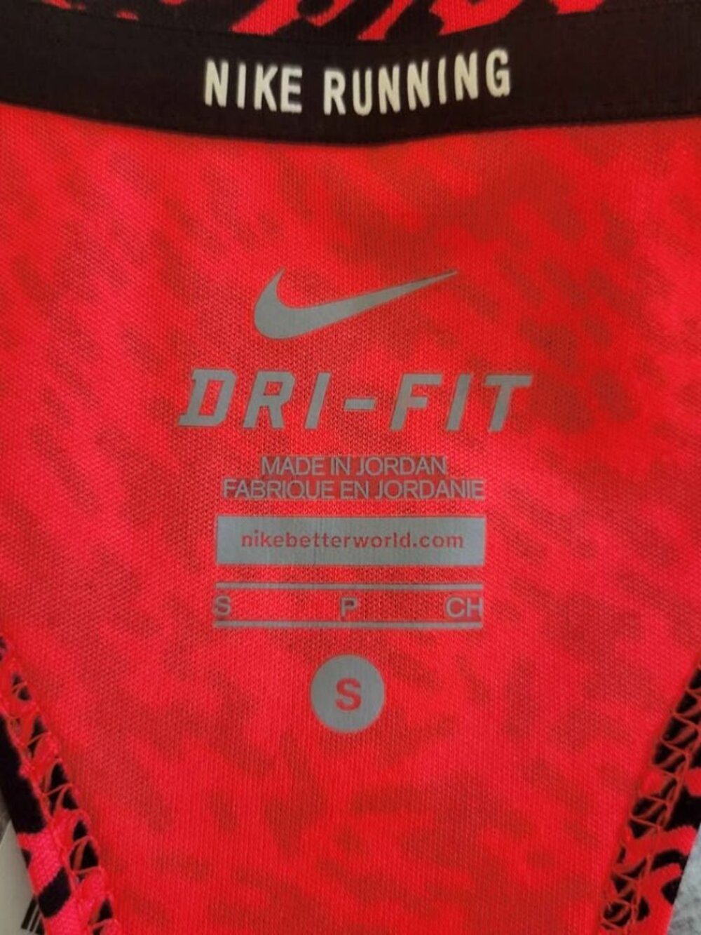 Nike Dri-Fit Racerback Running Tank Top In A Coral And Black Abstract Pattern - Picture 7 of 8